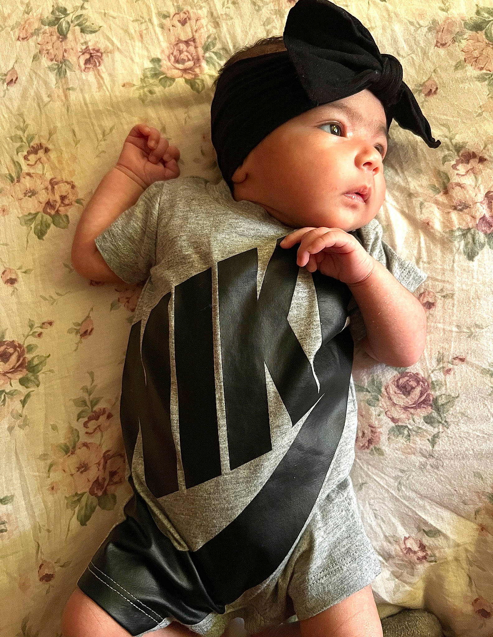 Amora is registered to the contest to win money with this photo: baby, baby_toddler_clothing, baseball_cap, cap, chest, cool, hat, headwear, neck, outerwear, pattern, person, personal_protective_equipment, skin, sleeve, sun_hat, t_shirt, thigh, toddler, trunk