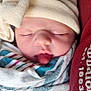 Aurora joined the competition — help win amazing prizes! newborn, baby, sleeping, hat, bow, blanket, wrapped, tongue_out, cozy, cute, infant, closeup, face, person, apparel, soft, resting, indoors, child, adorable