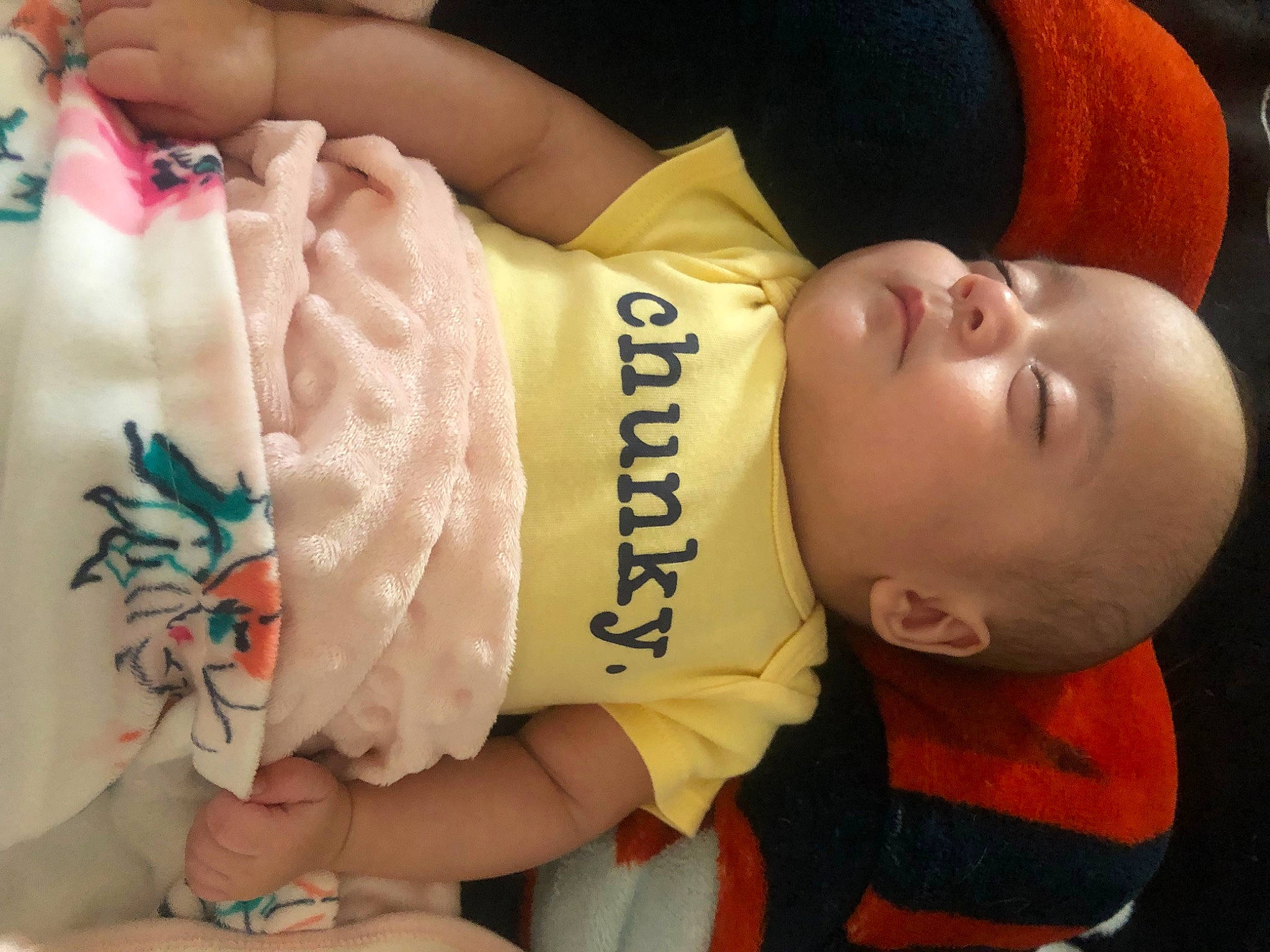 Luna is registered to the contest to win money with this photo: arm, baby, baby_toddler_clothing, cheek, child, elbow, finger, hand, human, human_body, joint, mouth, neck, nose, orange, person, skin, sleeve, textile, thumb