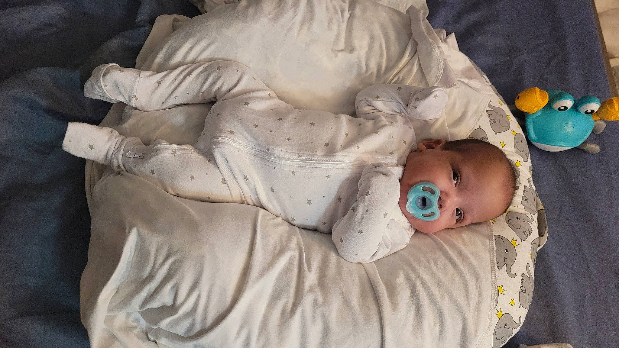 Miguel is registered to the contest to win money with this photo: arm, baby, baby_products, baby_sleeping, baby_toddler_clothing, bedtime, cheek, chest, child, comfort, eye, head, human_body, linens, nap, person, room, sculpture, sleep, toddler
