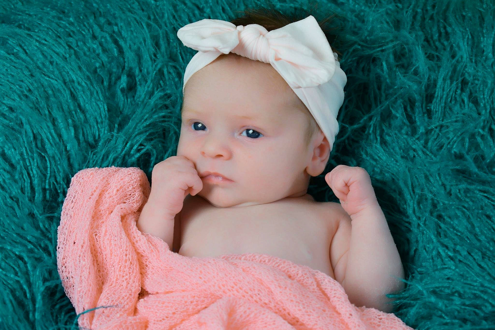 Ava-mae is registered to the contest to win money with this photo: aqua, azure, baby, baby_toddler_clothing, blue, child, electric_blue, face, fashion_accessory, flash_photography, grass, hair_accessory, happy, headband, headgear, headpiece, pattern, person, pink, textile