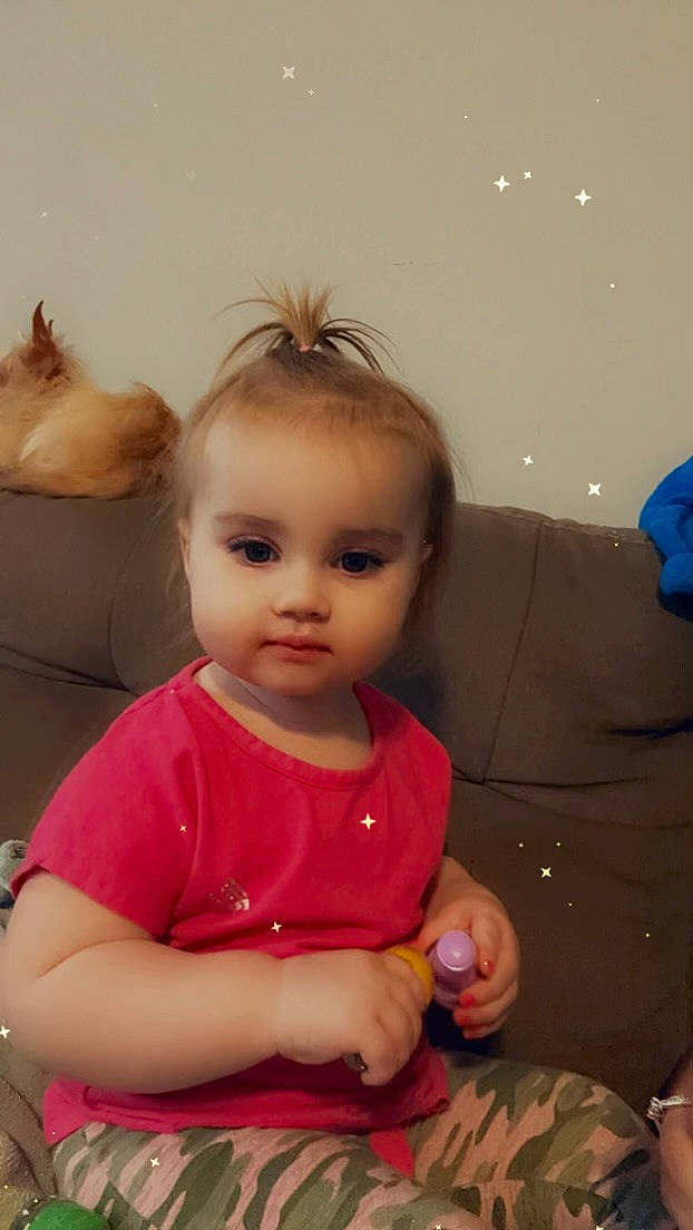 Alayna is registered to the contest to win money with this photo: arm, baby, baby_toddler_clothing, cheek, child, ear, event, eyelash, facial_expression, fun, hair, hairstyle, happy, head, iris, nail, neck, person, sitting, skin