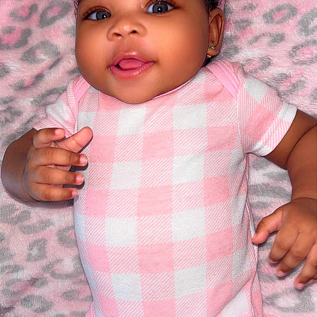 Azaria Armoni Hart joined the competition — help win amazing prizes! baby, infant, smiling, pink_clothing, headband, blanket, leopard_print, cute, happy, portrait, child, skin, hand, face, lying_down, one_piece, indoors, cheerful, young_child, closeup