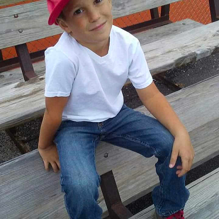 Zak is registered to the contest to win money with this photo: cap, child, child_model, denim, footwear, headgear, headwear, jeans, joy, leg, person, play, sitting, sun_hat, t_shirt, toddler, wood