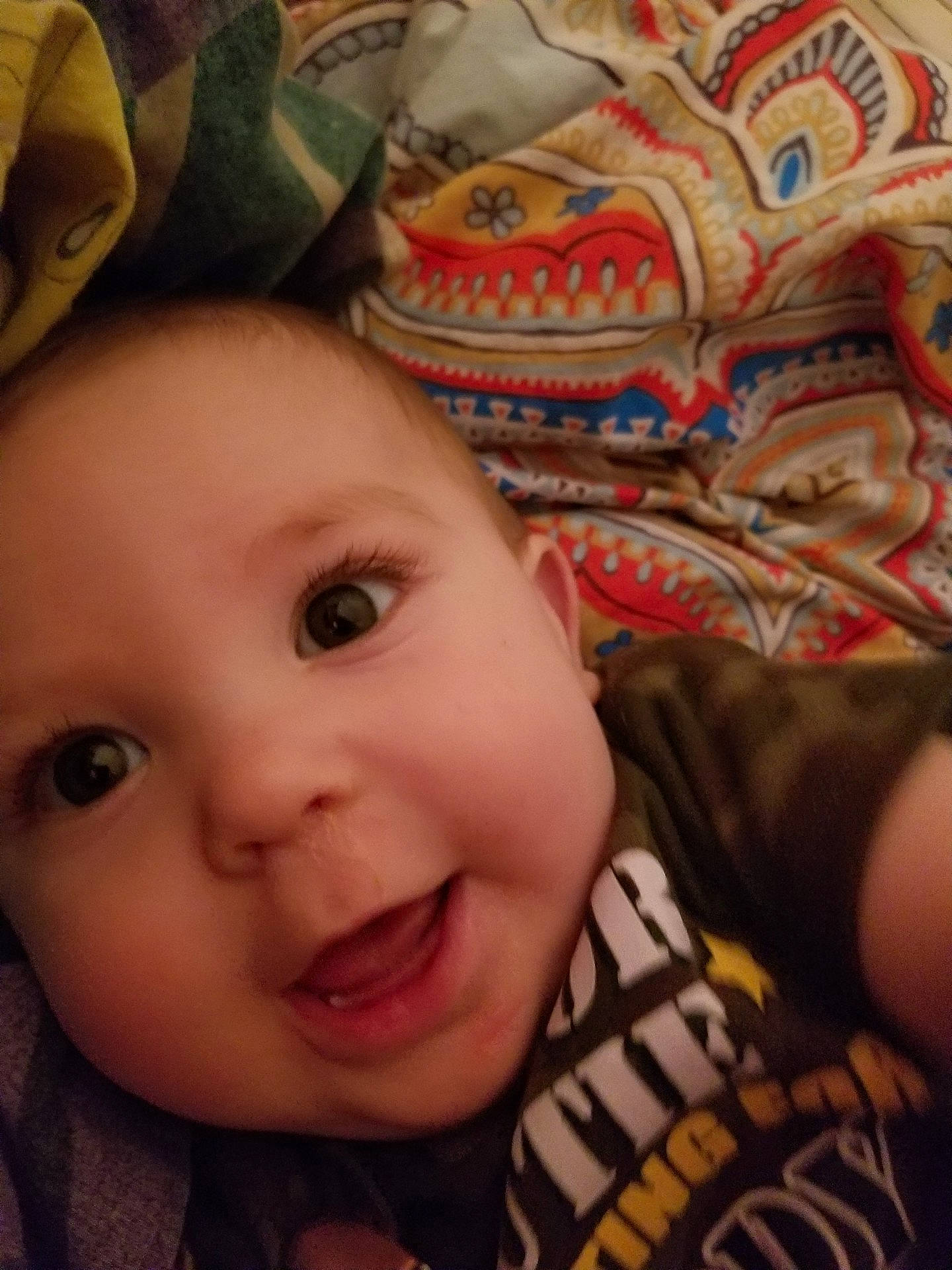 George is registered to the contest to win money with this photo: cheek, child, chin, eye, eyebrow, face, finger, forehead, girl, hand, head, infant, iris, lip, mouth, nose, organ, person, skin, smile