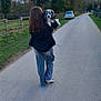 Lady Joyce participe au concours pour gagner de l'argent avec cette photo : person, dog, walking, road, trees, car, outdoor, nature, grass, fence, cloudy_sky, animal, leisure, casual_clothing, back_view, rural, transport, daytime, holding, companion