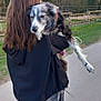 Lady Joyce a rejoint le concours — aidez-le/la à gagner de superbes lots ! person, dog, walking, outdoor, path, fence, trees, grass, jacket, jeans, leash, animal, canine, nature, daytime, casual, human, friendship, companionship, blur