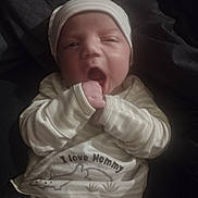 Braylen joined the competition — help win amazing prizes! baby, blanket, child, clothing, cozy, cute, cute_expression, face, hand, hat, indoors, infant, newborn, person, portrait, sleepy, soft_light, striped_clothing, warm, yawning