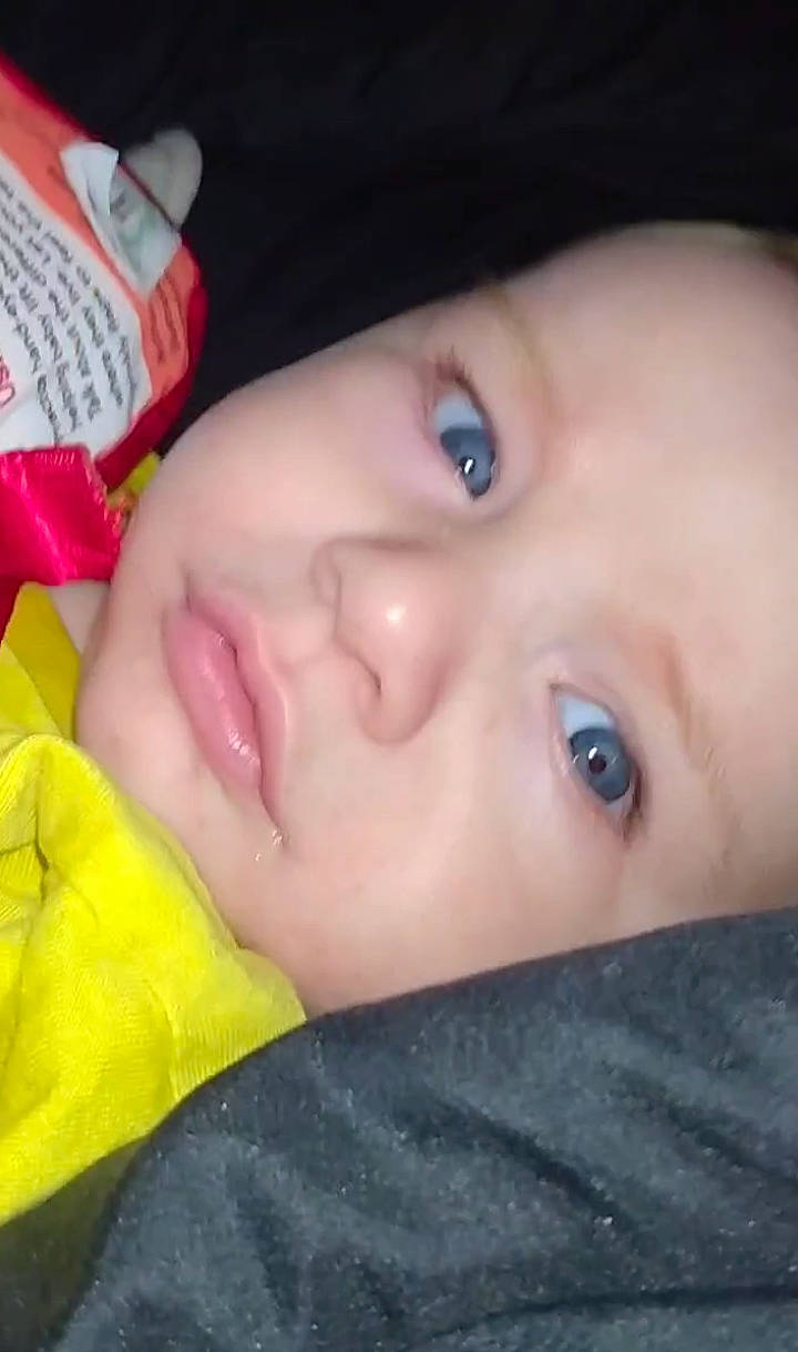 Danny is registered to the contest to win money with this photo: baby, cheek, child, chin, ear, eye, eyebrow, eyelash, finger, forehead, hair, headwear, human_body, iris, lip, mammal, mouth, nose, person, plant