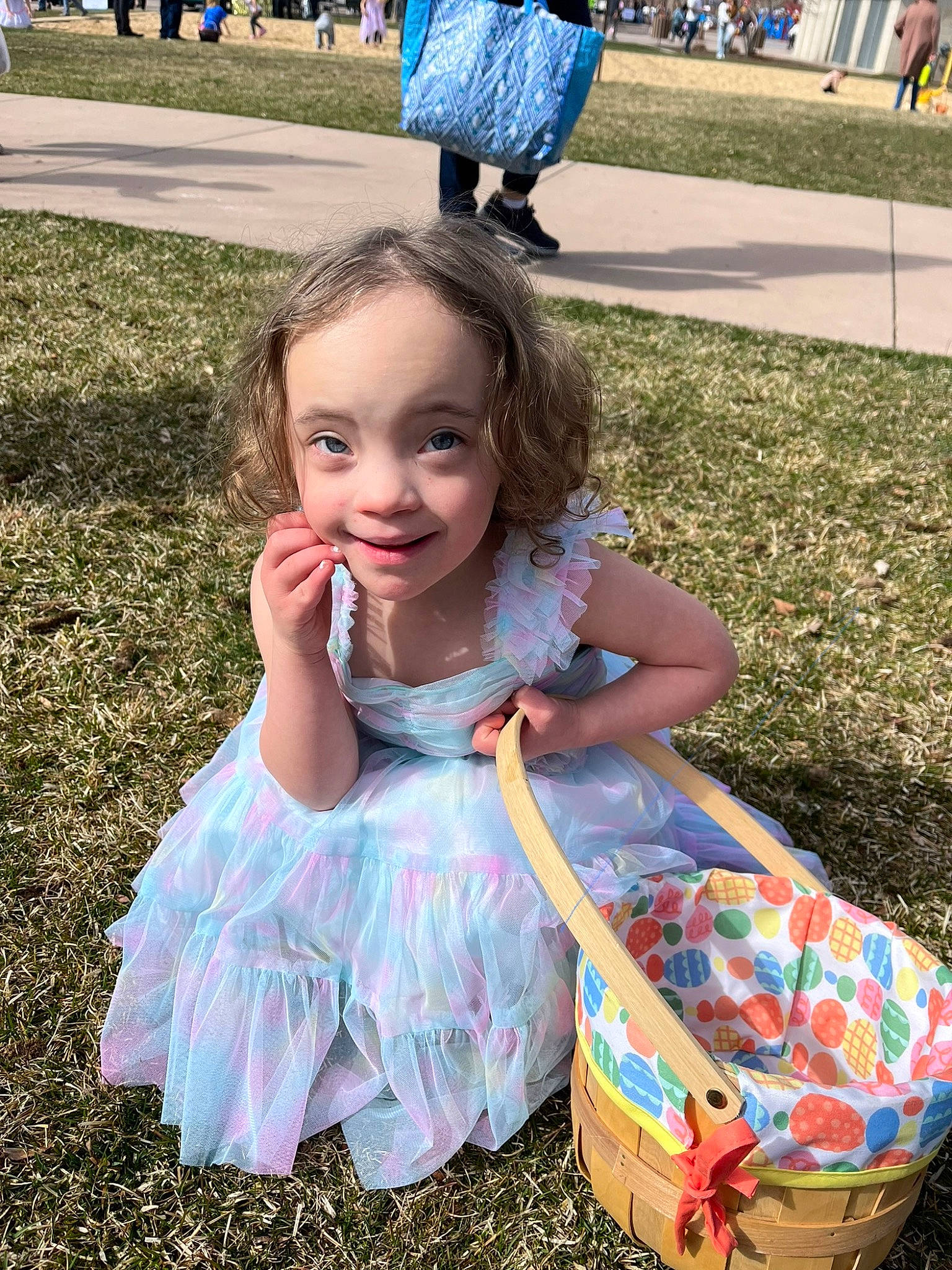 Ariya is registered to the contest to win money with this photo: baby_toddler_clothing, blue, child, dress, event, fun, grass, green, happy, joy, leisure, people_in_nature, person, photograph, pink, recreation, sitting, smile, spring, summer