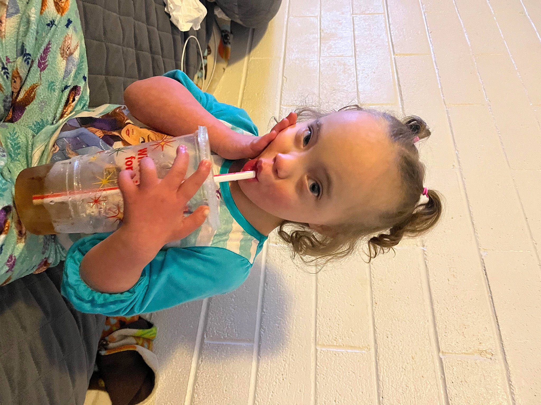 Ariya is registered to the contest to win money with this photo: baby, child, drinking, drinking_water, drinkware, eyelash, eyewear, flooring, food, fun, happy, leisure, nail, person, plastic_bottle, skin, tableware, toddler, water, water_bottle