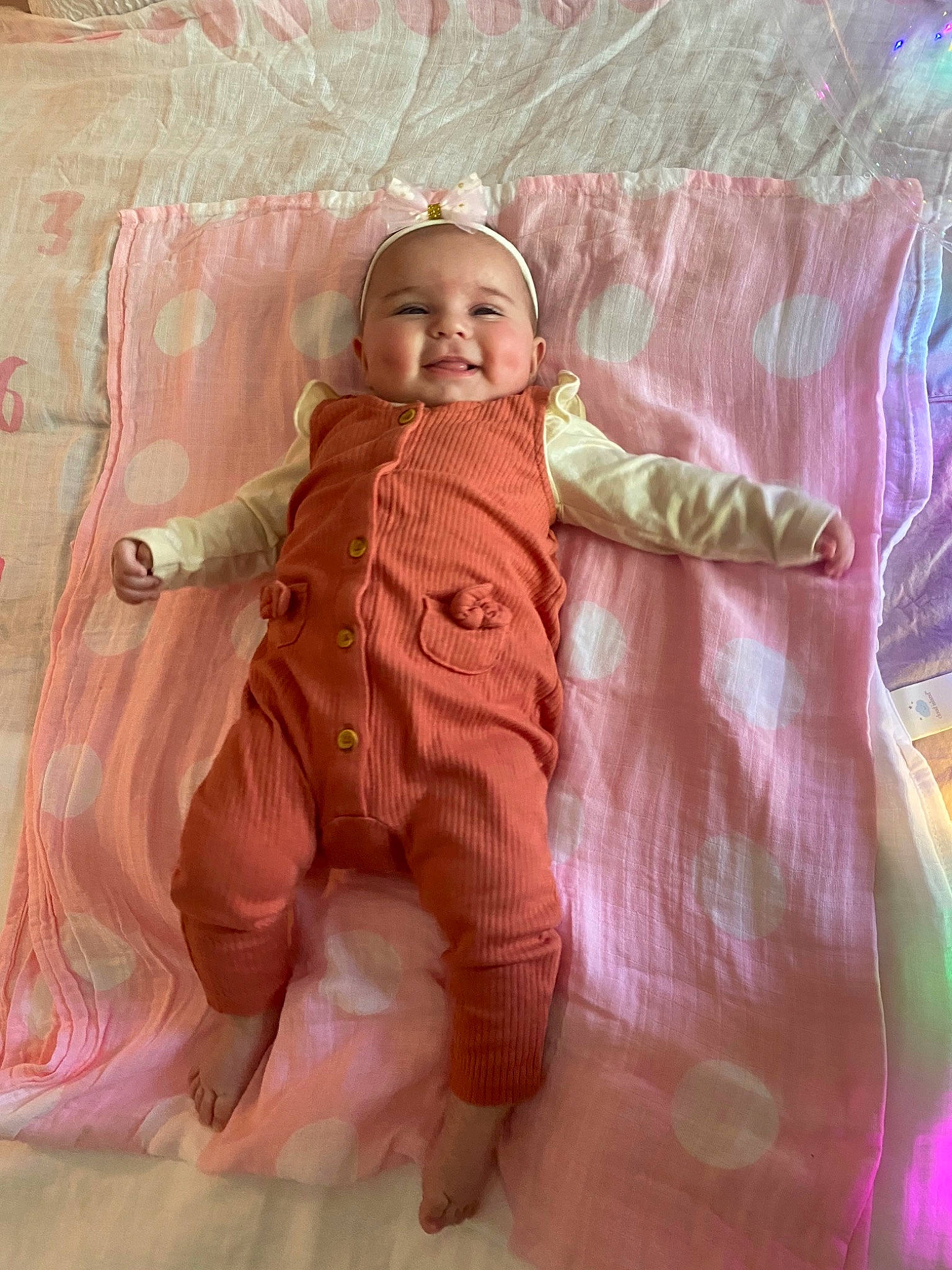 Roselina joined the competition — help win amazing prizes! baby, baby_toddler_clothing, barefoot, bedding, child, comfort, face, foot, fun, happy, head, headwear, linens, magenta, mammal, peach, person, pink, skin, smile