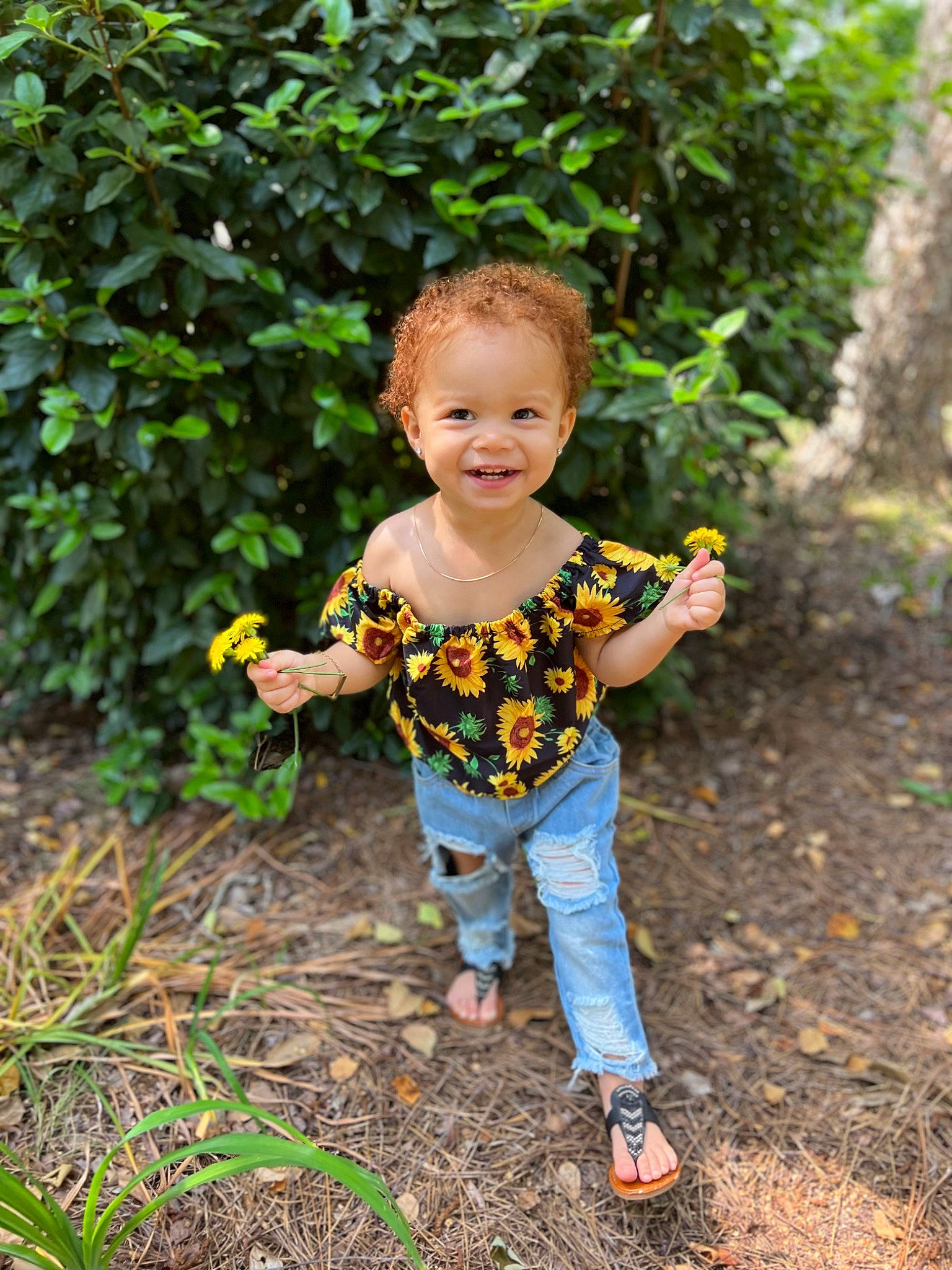 Angela joined the competition — help win amazing prizes! baby, baby_toddler_clothing, child, forest, fun, garden, grass, happy, joy, landscape, leaf, leg, mammal, people_in_nature, person, plant, sitting, smile, soil, t_shirt