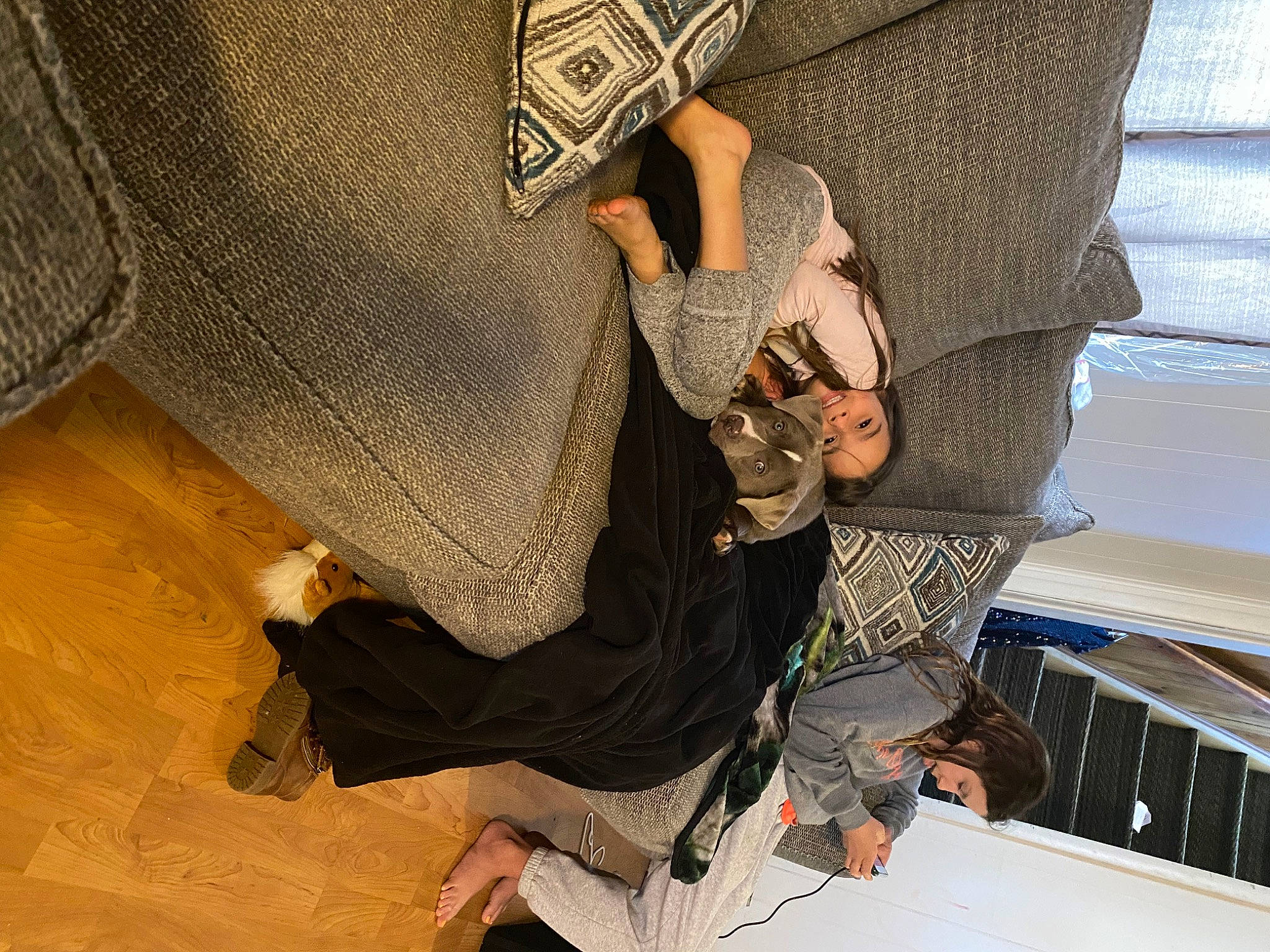 Camie is registered to the contest to win money with this photo: bag, comfort, denim, elbow, fashion_accessory, fashion_design, flooring, hardwood, hat, human_leg, pattern, person, pocket, room, sitting, sleeve, textile, thigh, waist, wood