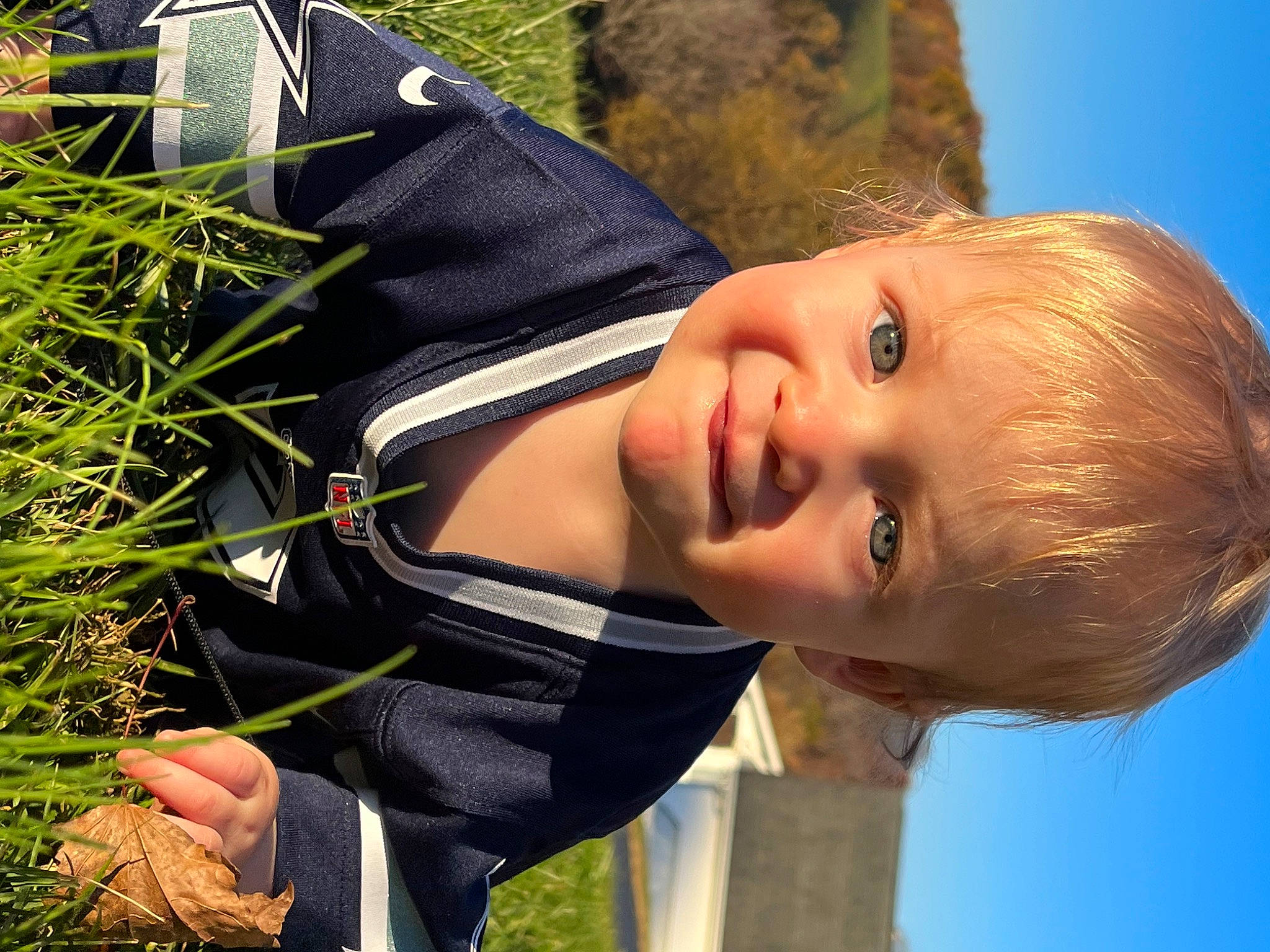 Juniper is registered to the contest to win money with this photo: child, child_model, eye, face, flash_photography, fun, grass, happy, leisure, nose, people_in_nature, person, portrait, portrait_photography, skin, sky, smile, sunlight, toddler, tree