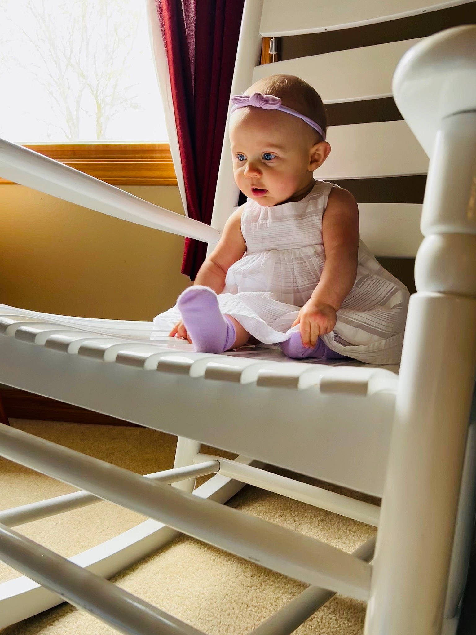 Madison is registered to the contest to win money with this photo: arm, baby, baby_toddler_clothing, child, comfort, curtain, elbow, hand, handrail, happy, hardwood, leisure, person, room, sitting, smile, stairs, t_shirt, toddler, window