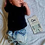 baby, infant, one_month_old, milestone_card, elephant_illustration, black_shirt, denim_pants, nike_socks, blanket, soft_texture, cute, portrait, newborn, lying_down, curious_expression, small_hands, baby_clothing, baby_fashion, indoor, celebration