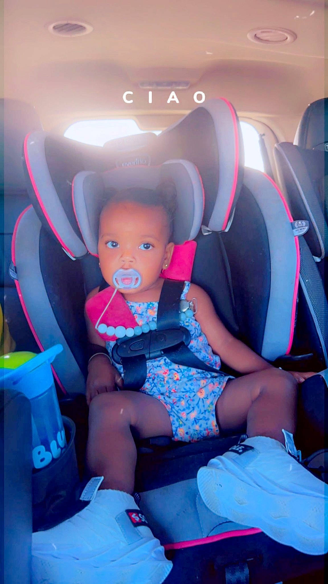 La Raya is registered to the contest to win money with this photo: car_seat, carmine, child, costume, doll, electric_blue, family_car, fictional_character, fun, hat, human_leg, lap, leg, leisure, magenta, person, sitting, sock, thigh, toddler