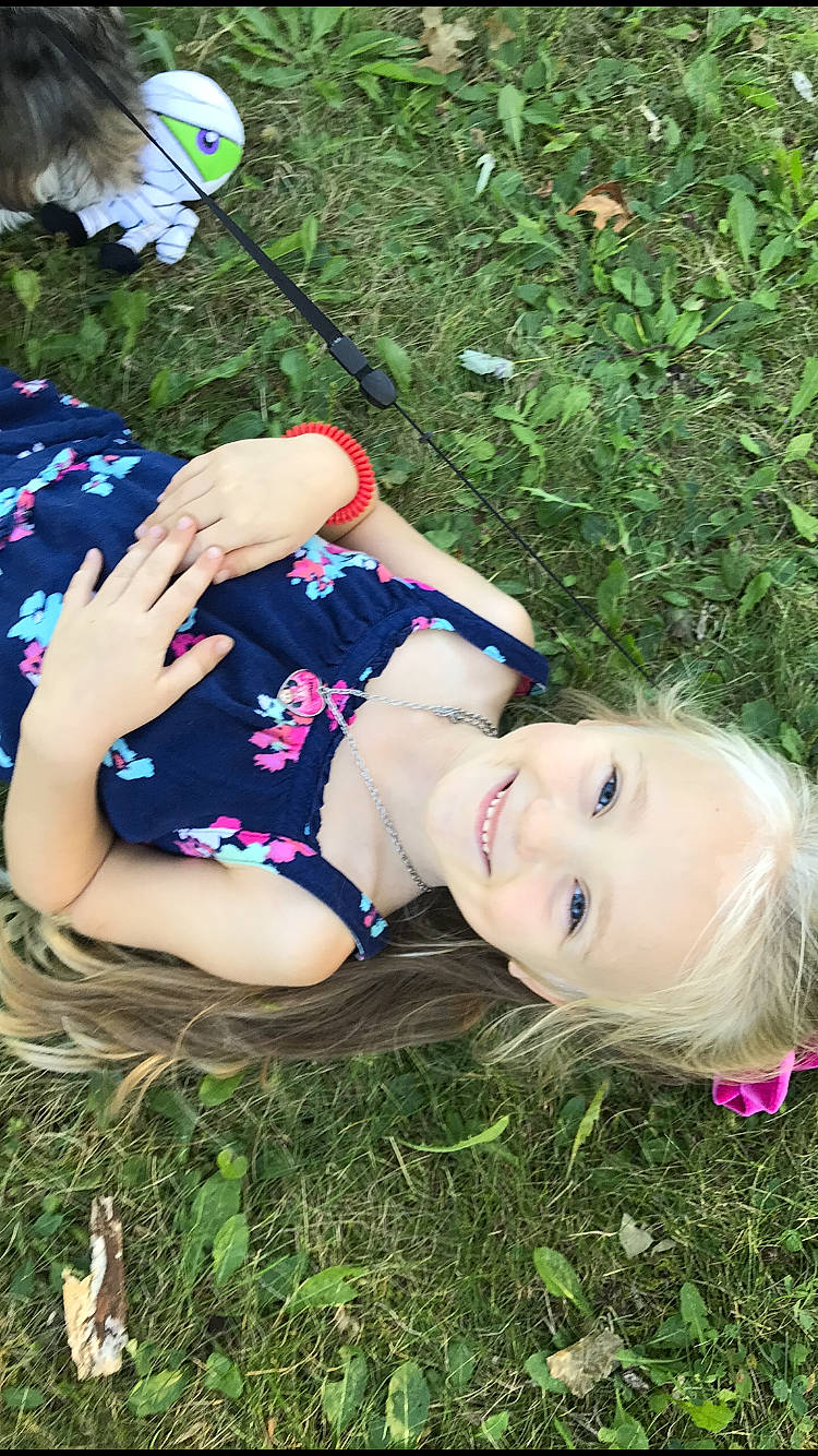 Skylar joined the competition — help win amazing prizes! child, electric_blue, fun, grass, grassland, happy, human_leg, joy, lawn, leisure, mammal, meadow, people_in_nature, person, recreation, sitting, smile, spring, summer, thigh