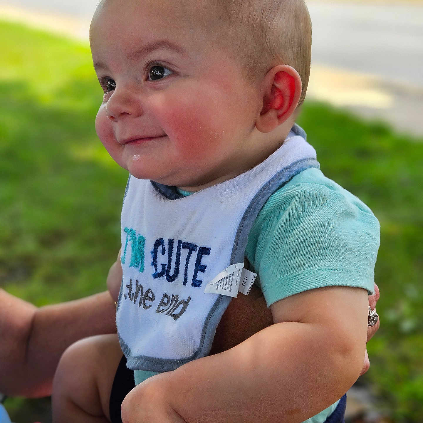 Mason joined the competition — help win amazing prizes! accessories, baby, bodypart, bracelet, clothing, face, finger, grass, hand, head, jewelry, pants, person, photography, plant, portrait, shorts, sitting, strap, t_shirt