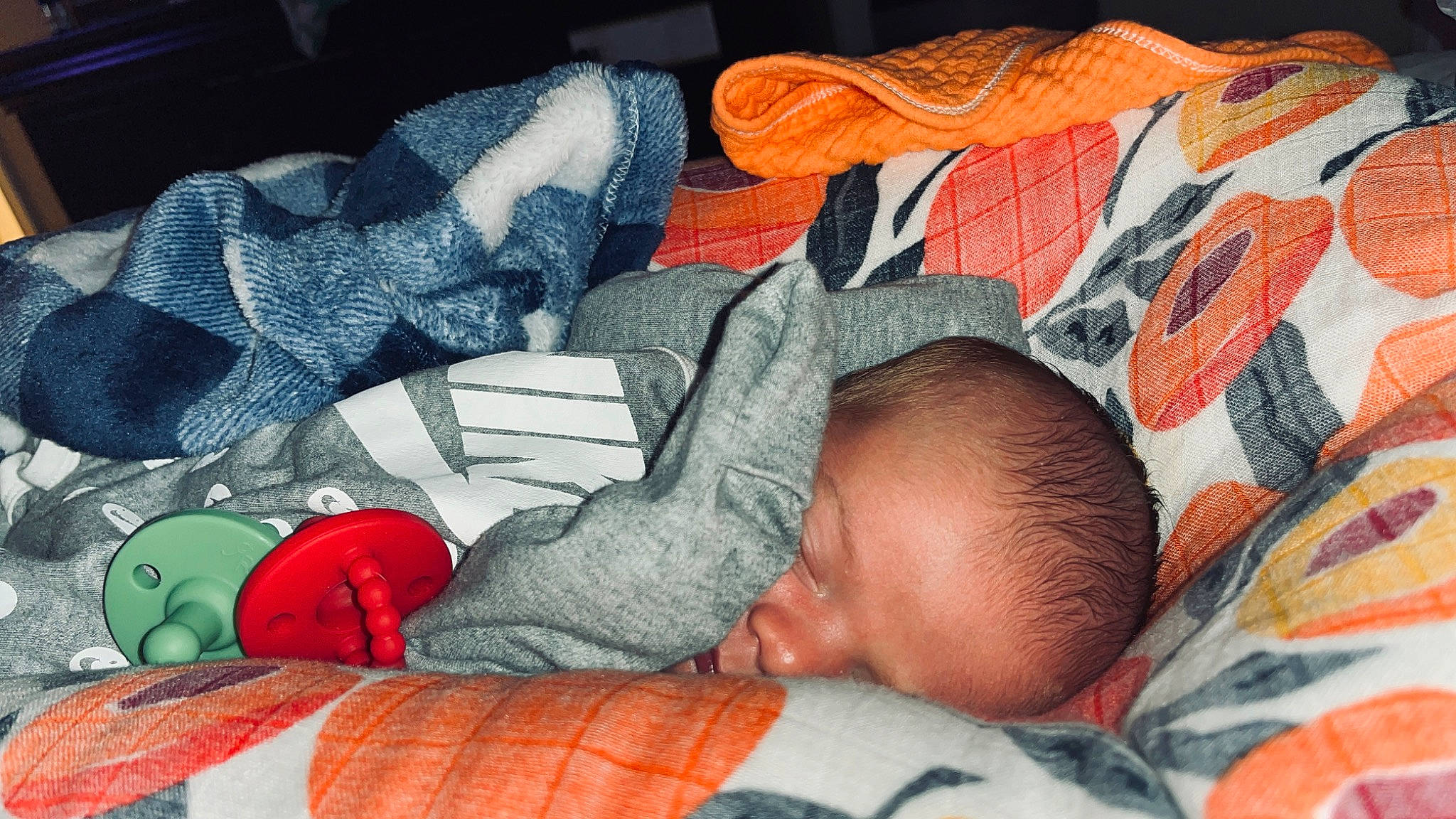 Ledger joined the competition — help win amazing prizes! baby, baby_products, baby_sleeping, baby_toddler_clothing, bed_sheet, bedding, bedtime, carmine, child, comfort, linens, mouth, nap, orange, pattern, person, product, red, room, textile