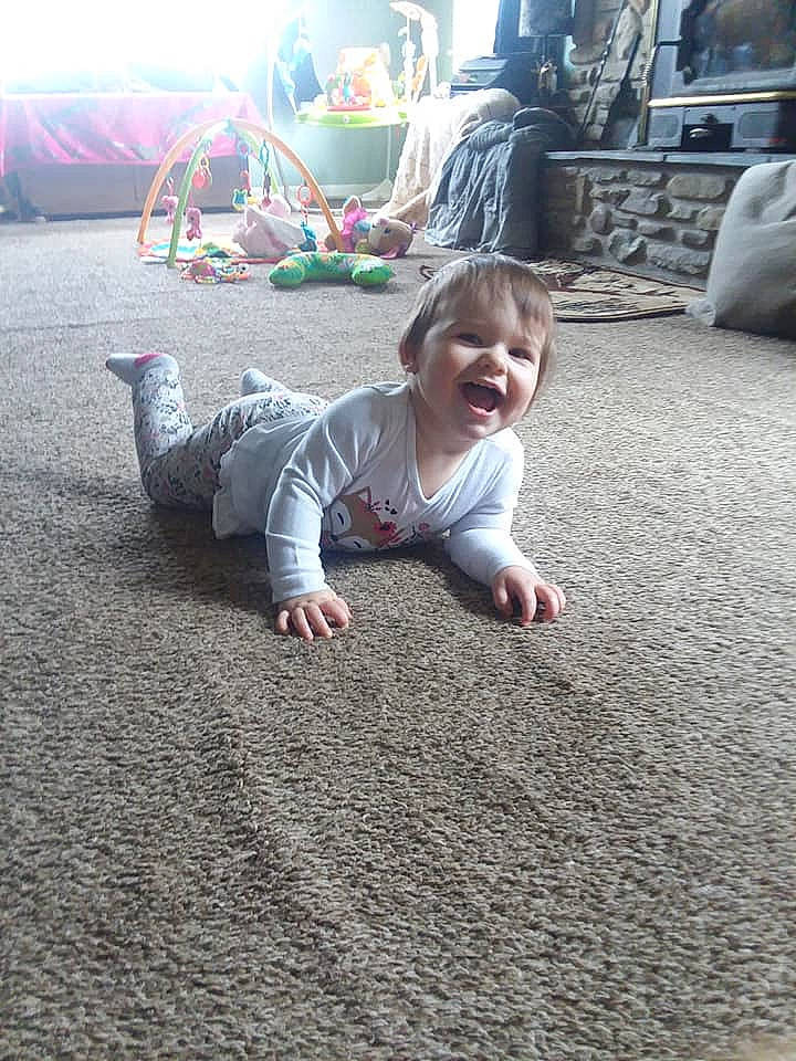 Kaylin joined the competition — help win amazing prizes! baby, child, crawling, floor, flooring, fun, grass, person, play, sand, sitting, toddler, vacation