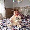 Soulaymane participe au concours pour gagner de l'argent avec cette photo : baby, child, indoor, bed, blanket, bubbles, smiling, clothing, socks, curtain, pillow, floral, pattern, person, cute, happy, sitting, soft_light, cozy, playful