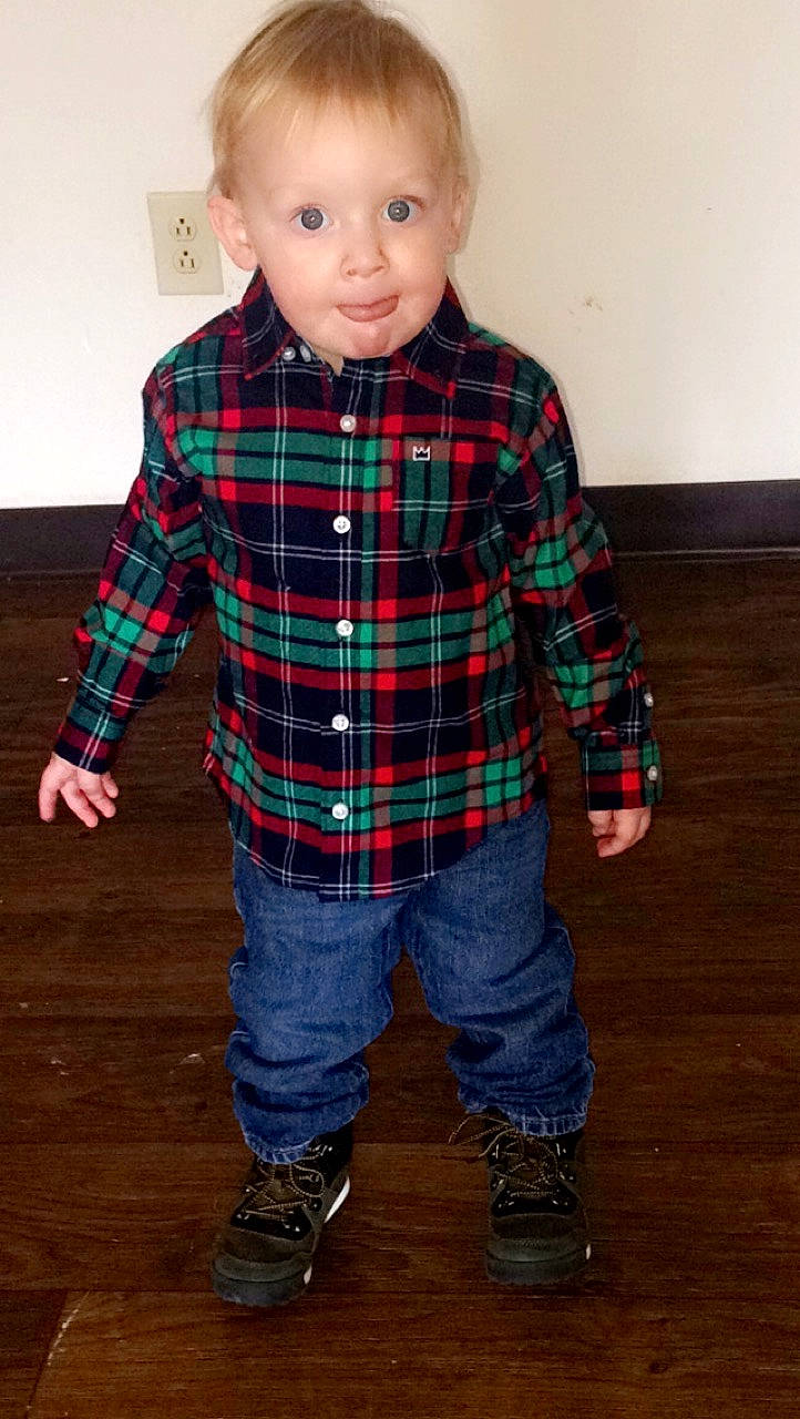 Axton is registered to the contest to win money with this photo: child, child_model, clothing, denim, design, jeans, male, outerwear, pattern, person, plaid, sleeve, standing, tartan, textile, toddler