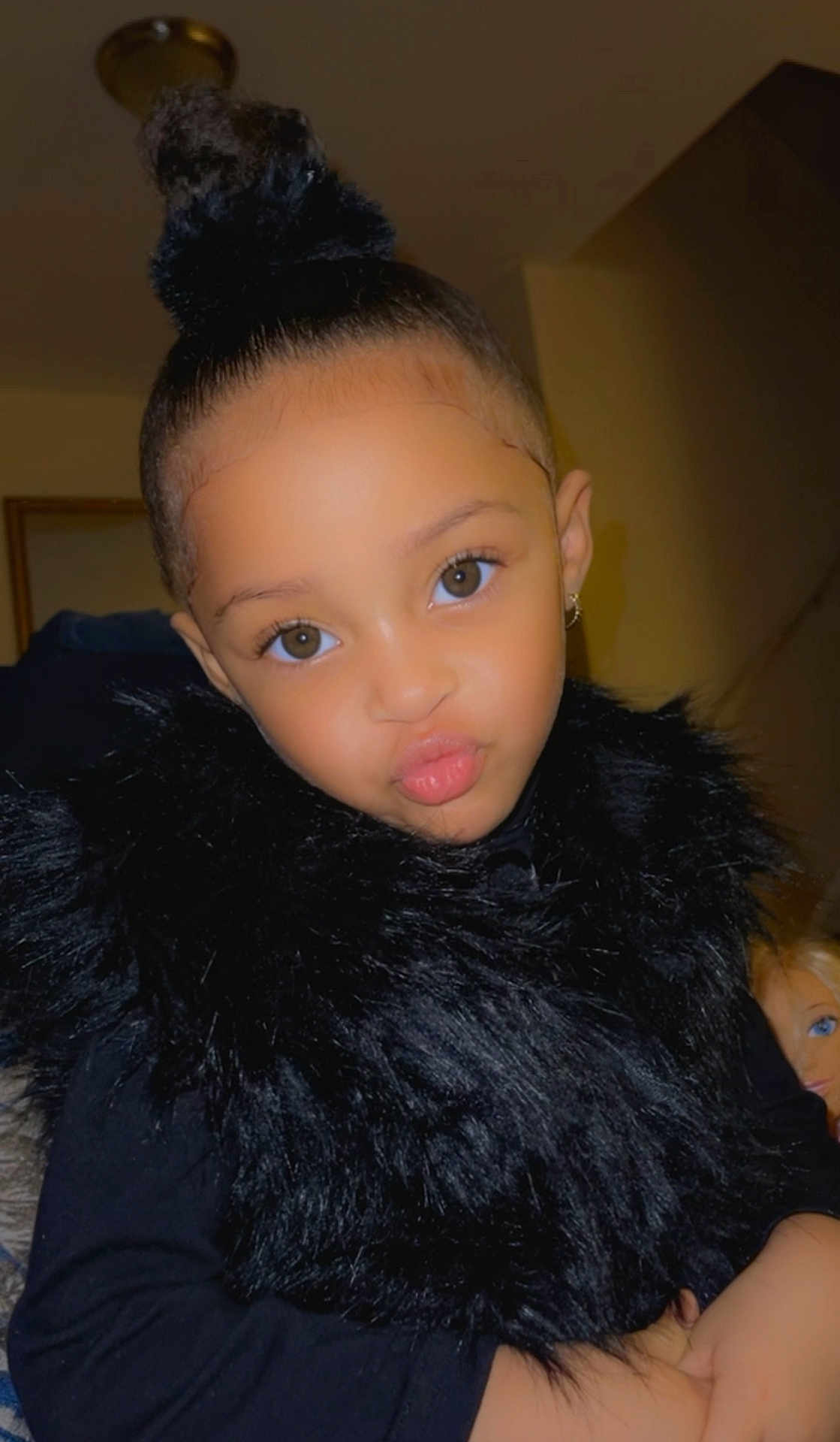 Myara is registered to the contest to win money with this photo: child, portrait, indoor, pout, black_clothing, fur, hairstyle, bun, cute, face, person, young, fashion, expression, earring, skin, eyes, pose, smile, confidence