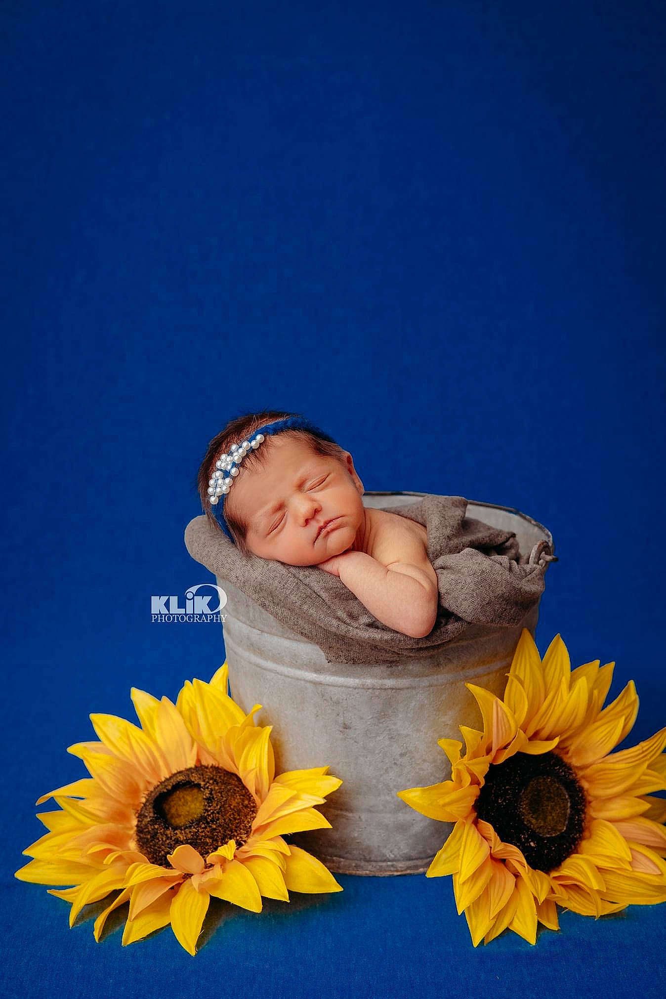 Evelyn joined the competition — help win amazing prizes! baby, baby_toddler_clothing, child, cut_flowers, daisy_family, electric_blue, flooring, flower, flowering_plant, fun, grass, happy, headgear, people_in_nature, person, petal, plant, sky, smile, sunflower