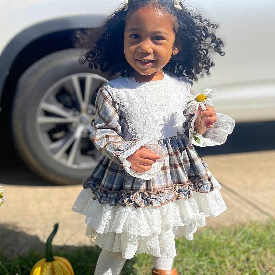 Ayana Etta Redd joined the competition — help win amazing prizes! alloywheel, car, carwheel, child, clothing, face, female, girl, grass, head, machine, person, photography, plant, portrait, spoke, tire, transportation, vehicle, wheel