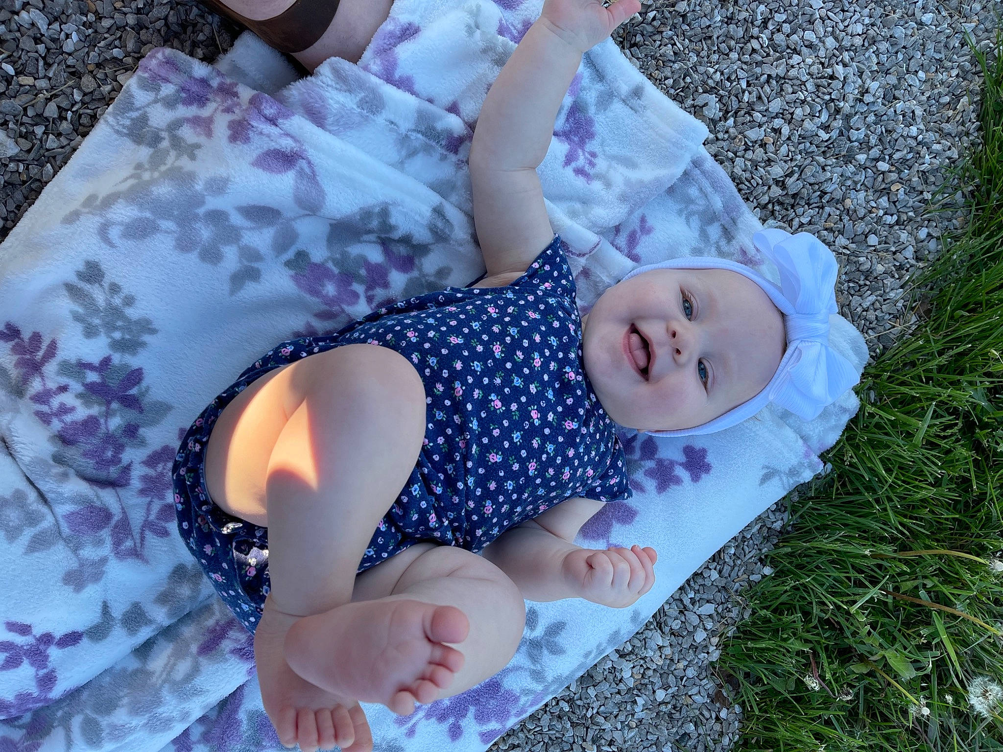 Nova Leann joined the competition — help win amazing prizes! baby, baby_toddler_clothing, child, dress, fun, grass, hand, happy, headwear, human_body, leisure, pattern, people_in_nature, person, plant, purple, skin, smile, summer, thigh