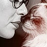 affection, animal, black_and_white, calm, cat, close_up, eyes_closed, face, fluffy_cat, glasses, indoor, intimacy, love, nose_to_nose, person, pet, portrait, soft_light, tenderness, whiskers