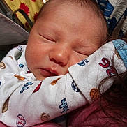 Landon joined the competition — help win amazing prizes! baby, newborn, sleeping, face, person, clothing, onesie, infant, closeup, skin, head, hair, arm, cuddle, comfort, rest, peaceful, indoor, soft, warm