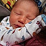 baby, newborn, sleeping, face, person, clothing, onesie, infant, closeup, skin, head, hair, arm, cuddle, comfort, rest, peaceful, indoor, soft, warm