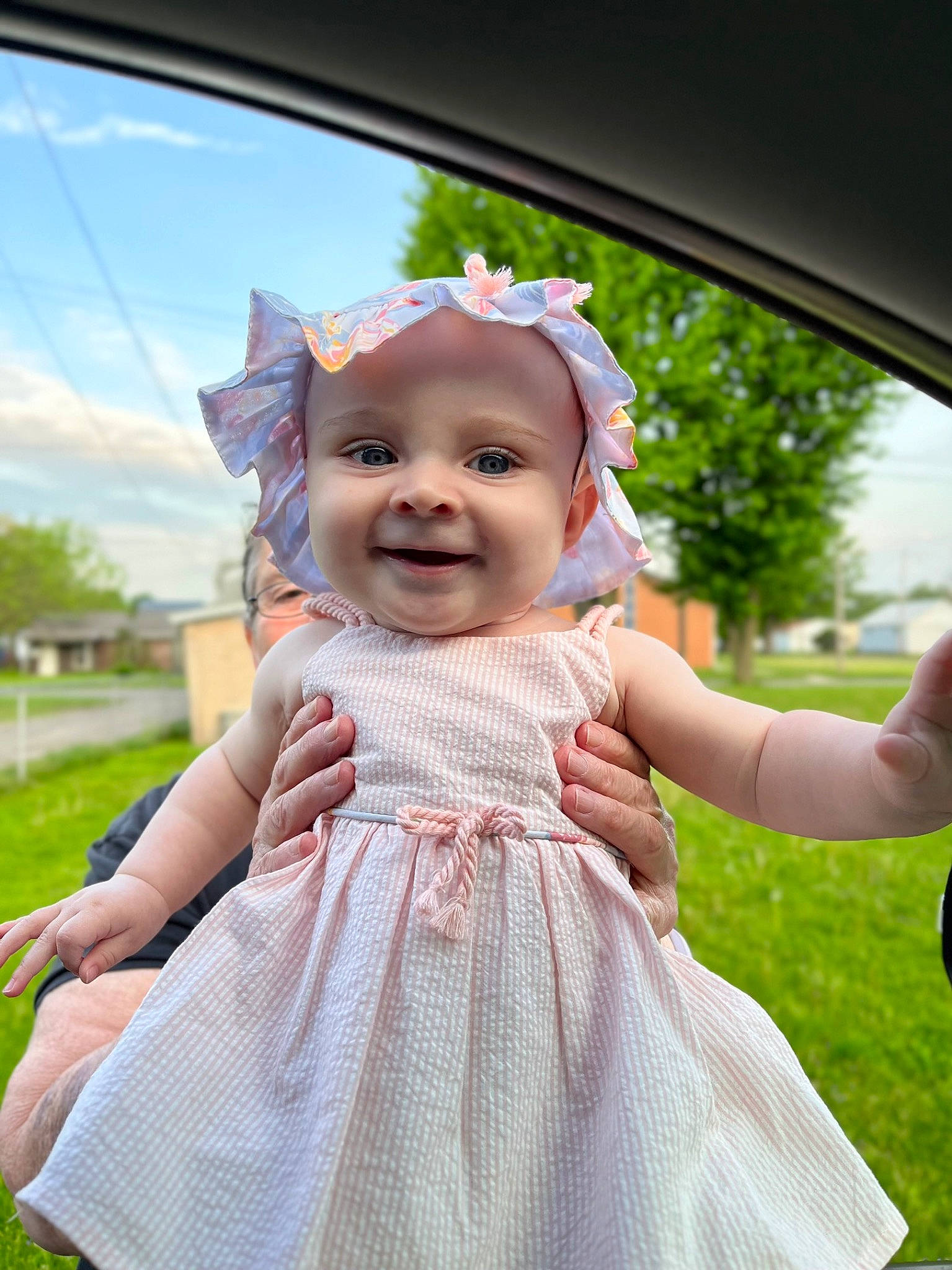 Koda is registered to the contest to win money with this photo: baby, baby_toddler_clothing, child, day_dress, dress, flash_photography, fun, gesture, grass, happy, headwear, joy, leisure, magenta, person, pink, plant, recreation, skin, sky