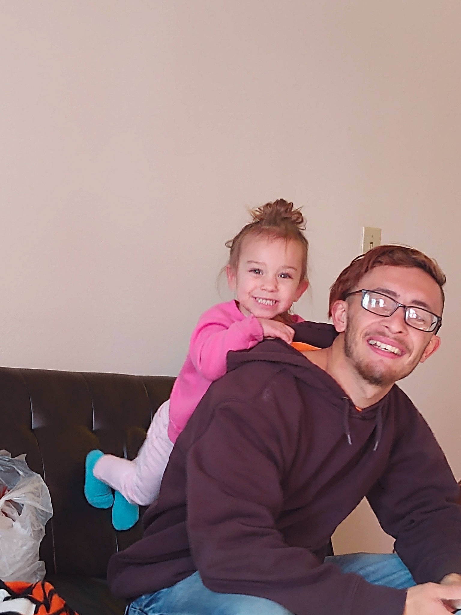 Iszy joined the competition — help win amazing prizes! arm, baby, child, family, fun, glasses, happy, joy, people, person, pink, red, room, sitting, smile, t_shirt, toddler, vacation