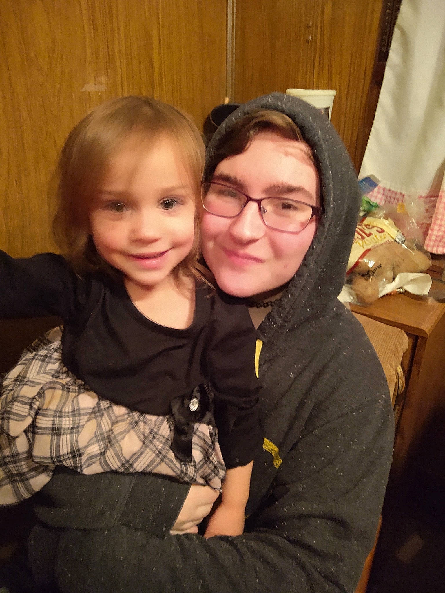 Iszy is registered to the contest to win money with this photo: cheek, child, daughter, face, facial_expression, family, friendship, fun, glasses, happy, head, people, person, sibling, sitting, skin, smile, toddler, vision_care