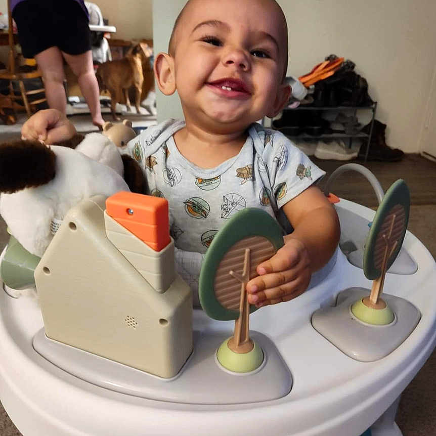 Jaxtyn is registered to the contest to win money with this photo: baby, clothing, cream, cutlery, dessert, diningtable, face, food, footwear, furniture, happy, head, icecream, person, photography, portrait, shoe, shorts, spoon, table