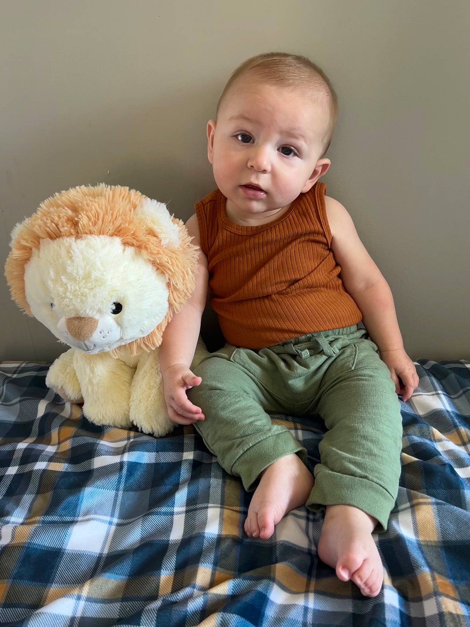 Karson joined the competition — help win amazing prizes! baby, baby_toddler_clothing, blue, child, comfort, doll, foot, human_body, linens, pattern, person, plaid, shorts, sitting, skin, sleeve, stuffed_toy, surprise, tartan, textile