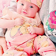 Destiny joined the competition — help win amazing prizes! baby, infant, pink_clothing, hat, winnie_the_pooh, person, hoodie, rose_design, indoor, green_leaves, cute, sitting, hands, face, eyes, cozy, soft_lighting, casual, denim, white_socks