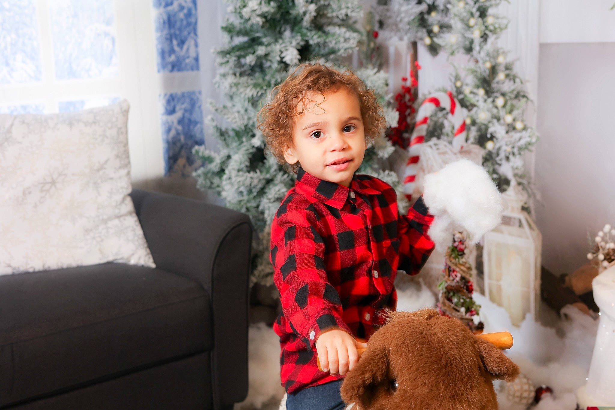 Ocean is registered to the contest to win money with this photo: child, christmas, christmas_decoration, christmas_ornament, christmas_tree, comfort, couch, event, face, happy, holiday, holiday_ornament, living_room, ornament, person, picture_frame, room, toddler, toy, tree