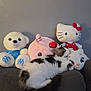 animal, cat, couch, cozy, cute, domestic_cat, furry, gray_wall, hello_kitty, home, indoor, pink_snail, plush_toys, relaxation, resting, sleeping, soft_toys, stuffed_animals, white_bear, white_cat_face
