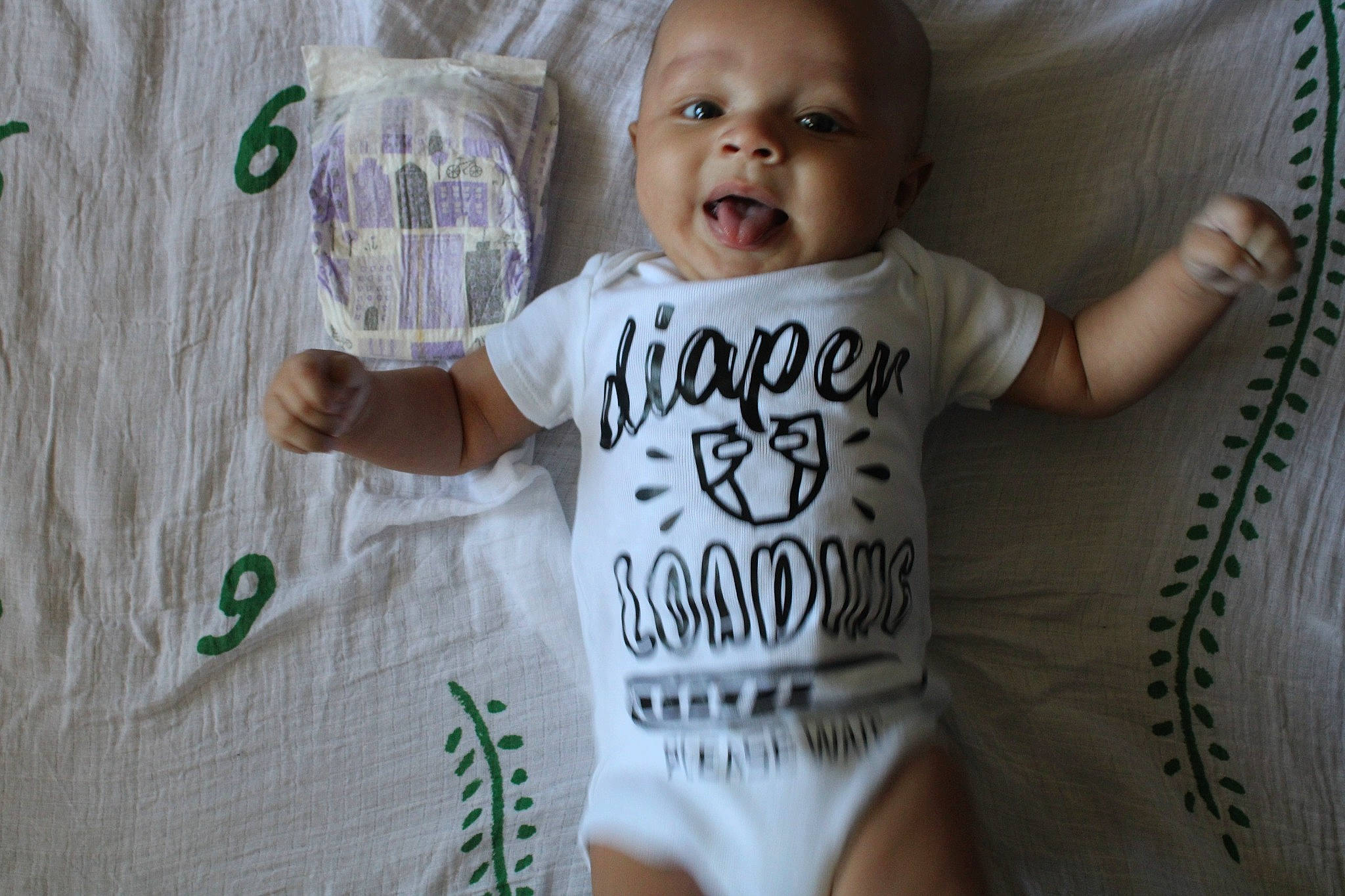 Myles is registered to the contest to win money with this photo: baby, baby_products, baby_toddler_clothing, child, linens, long_sleeved_t_shirt, nightwear, person, sleeve, toddler