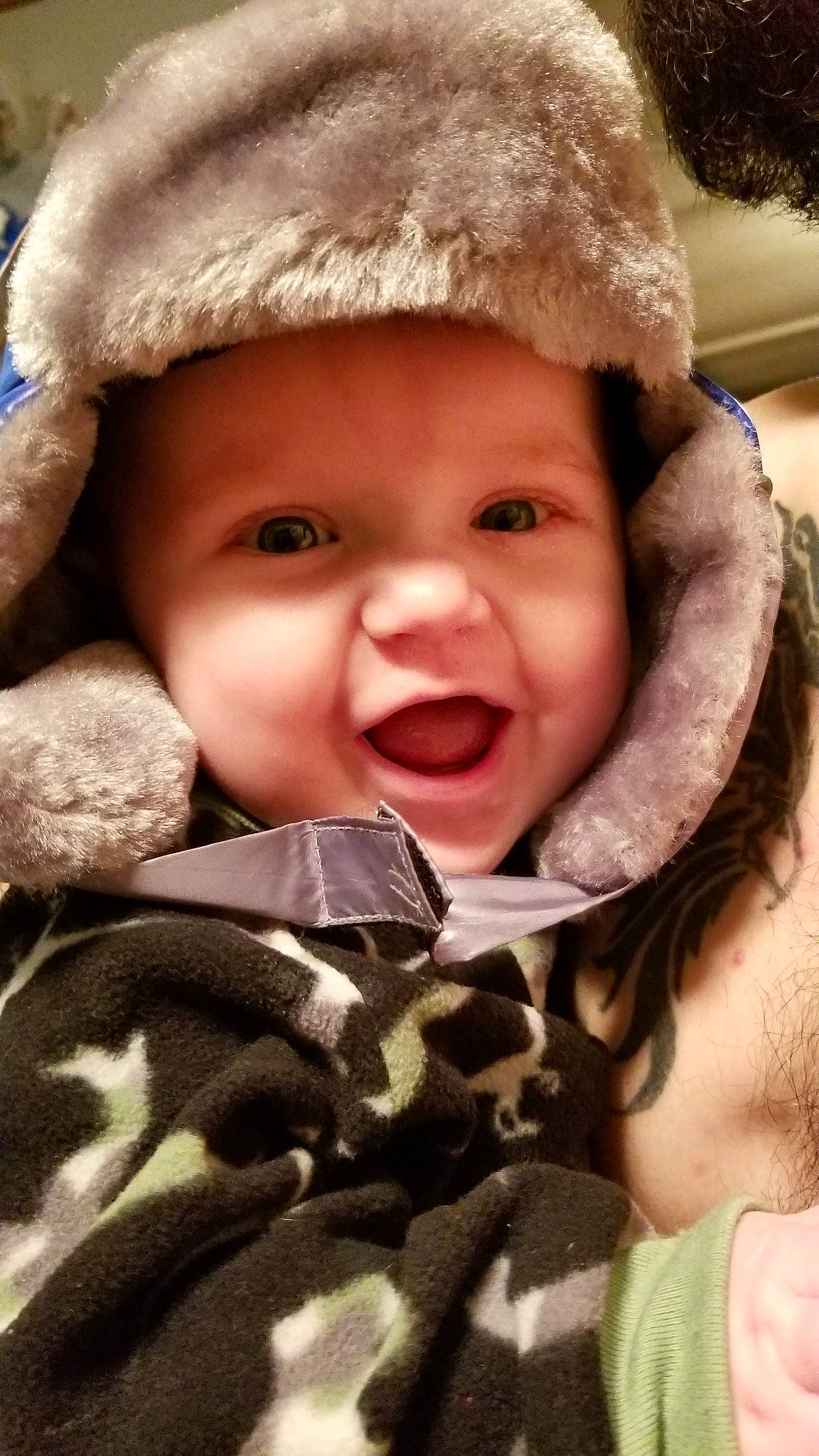 Cael is registered to the contest to win money with this photo: boy, cheek, child, emotion, eye, fur, girl, head, headwear, infant, laughter, mouth, nose, person, skin, smile, toddler