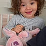 Giulia a rejoint le concours — aidez-le/la à gagner de superbes lots ! bedroom, child, childhood, comfort, cozy, curly_hair, cute, face, gray_clothing, happy, indoor, person, plush_toy, sitting, smile, soft_toy, stuffed_animal, toddler, toy, young_child