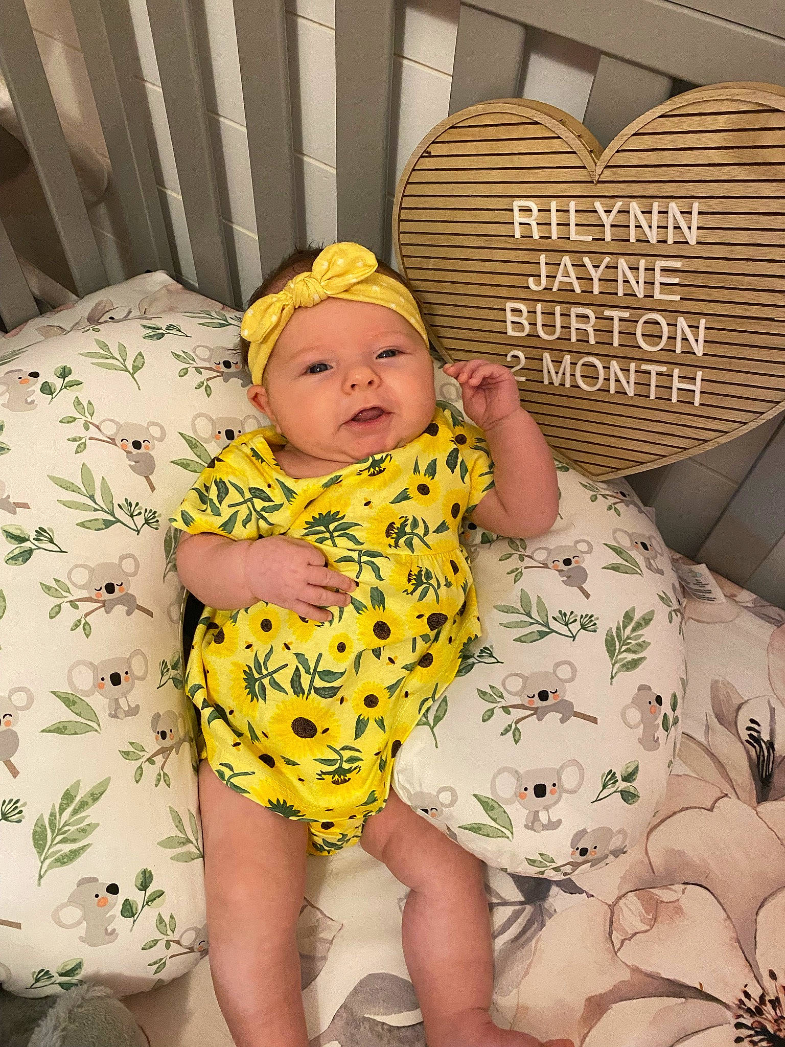 Rilynn is registered to the contest to win money with this photo: baby, baby_safety, baby_sleeping, baby_toddler_clothing, cap, child, comfort, face, facial_expression, happy, headwear, human, mammal, organ, people, person, pink, product, skin, sleeve