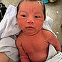 Ismael is registered to the contest to win money with this photo: newborn, baby, towel, skin, face, expression, hair, indoor, person, holding, child, curious, human, portrait, infant, cute, young, soft, wrapped, newborn_baby