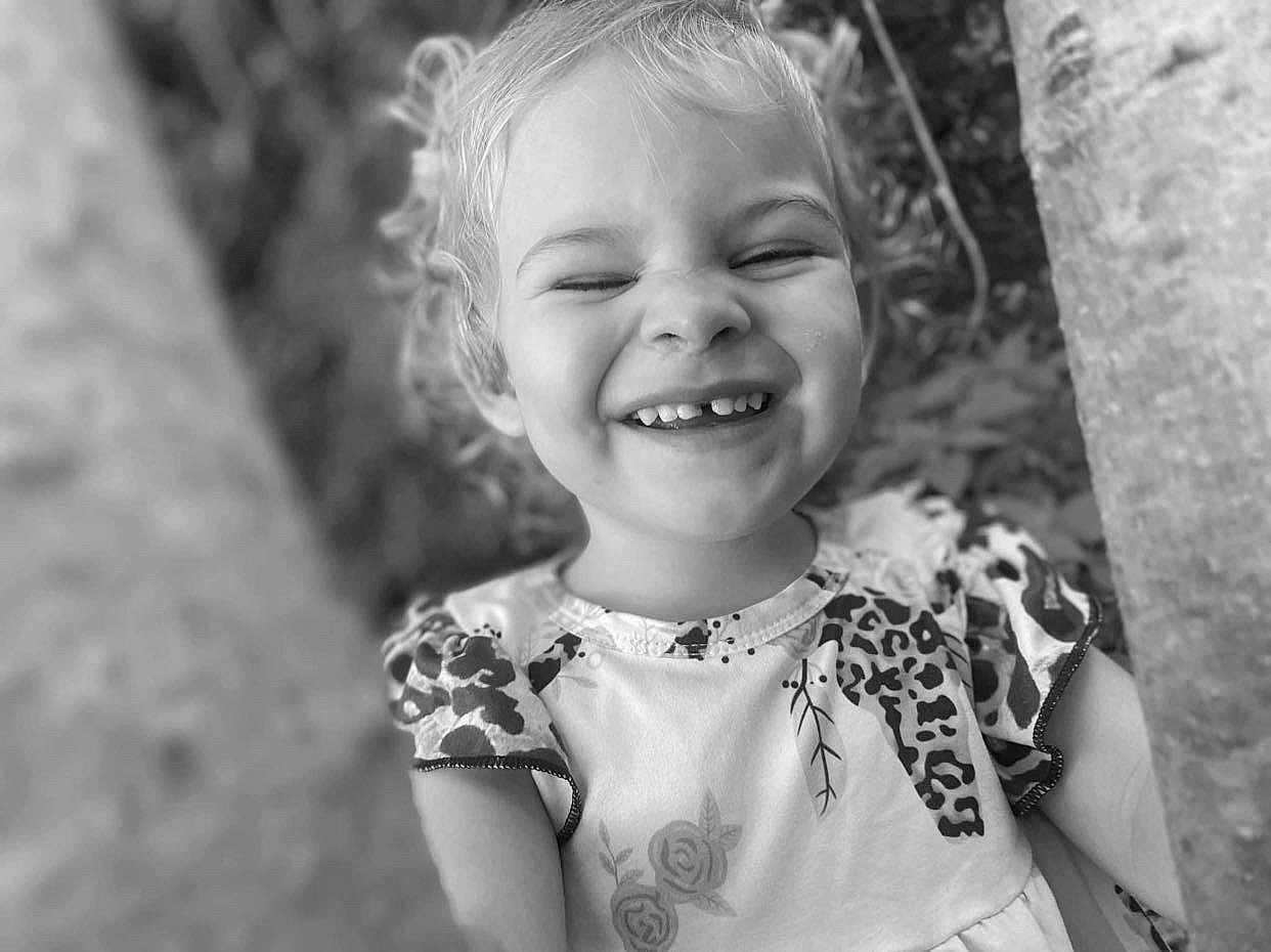 Adalynn is registered to the contest to win money with this photo: baby, babylaughing, blonde, blouse, bodypart, clothing, dress, face, hair, happy, head, laughing, mouth, person, photography, plant, portrait, smile, teeth, tree