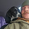 Buddy And Tilly joined the competition — help win amazing prizes! man, puppy, dog, car, seat, jacket, beanie, window, black_and_white, head, face, pet, indoor, portrait, mustache, curious, closeup, casual_clothing, young_adult, travel